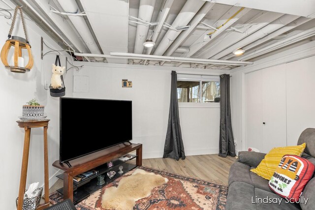 below grade area featuring wood finished floors