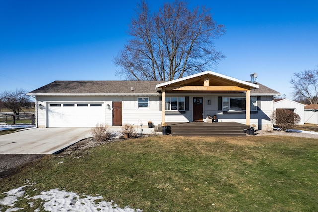 ranch-style house with an attached garage, concrete driveway, a front yard, and fence