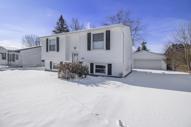 view of front of home featuring a garage and an outdoor structure