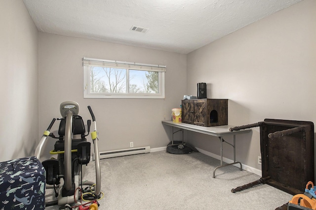 carpeted home office featuring baseboards, visible vents, baseboard heating, and a textured ceiling