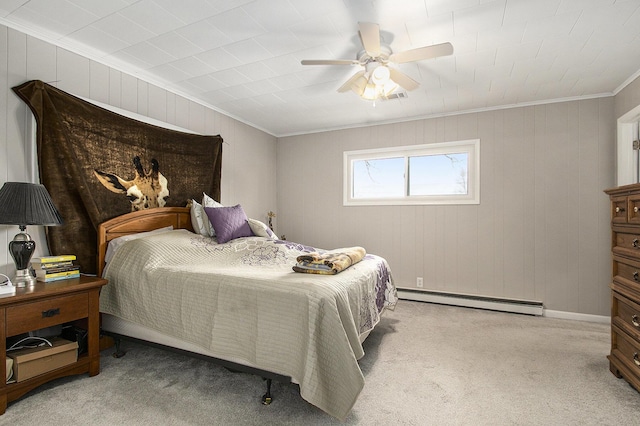 carpeted bedroom featuring a baseboard radiator, ceiling fan, and crown molding