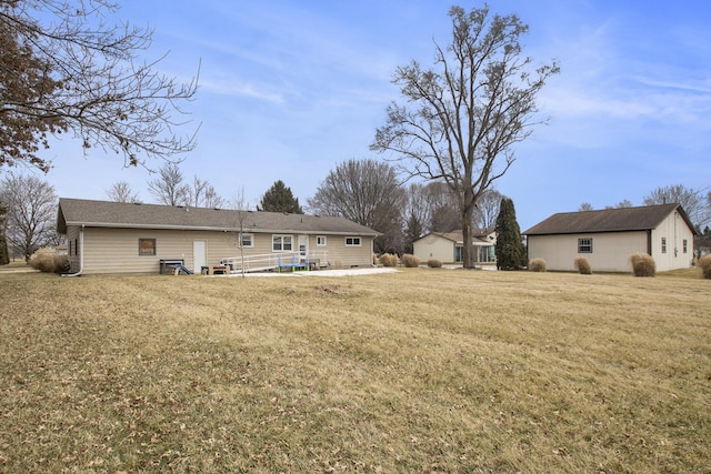 back of house with a yard