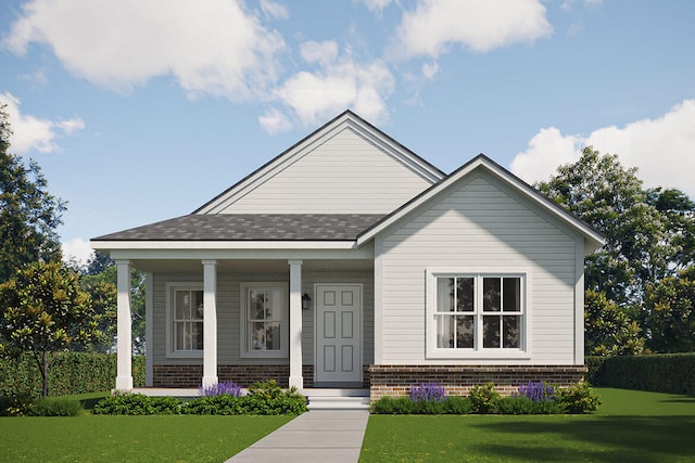 view of front of home with a porch and a front yard