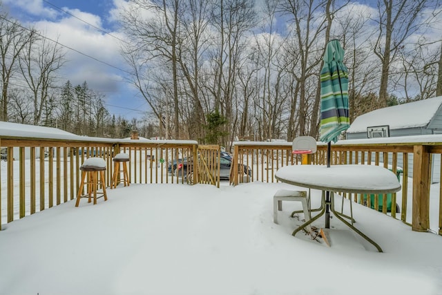 view of snow covered deck