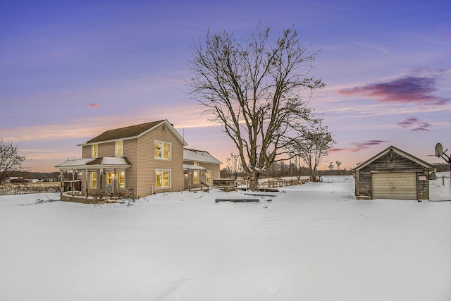 yard layered in snow with a garage