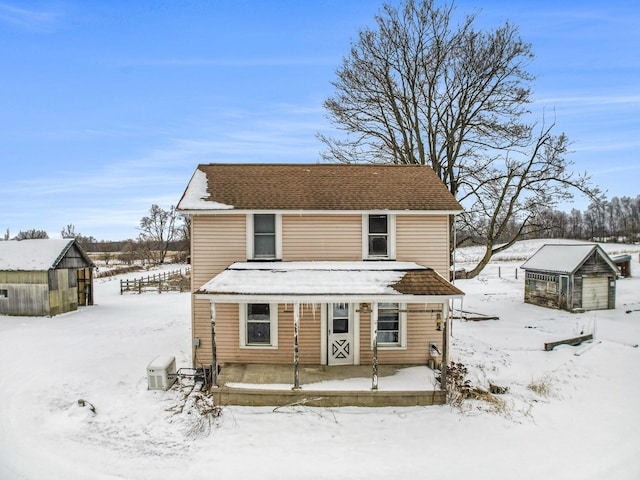 view of front of property with an outbuilding and an exterior structure