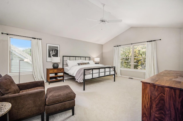 bedroom featuring lofted ceiling, ceiling fan, baseboards, and light colored carpet