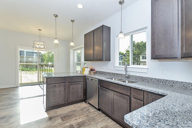 kitchen with sink, light stone countertops, and dishwasher
