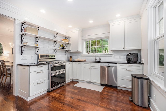 kitchen featuring sink, stainless steel appliances, and white cabinetry