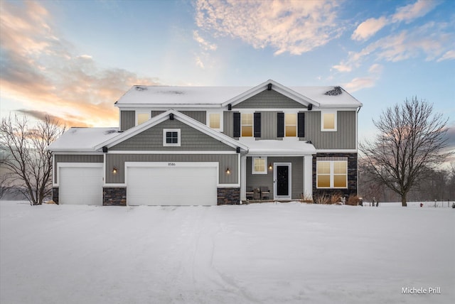 view of front of house featuring stone siding and an attached garage