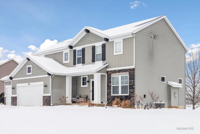 craftsman-style house featuring a garage and stone siding