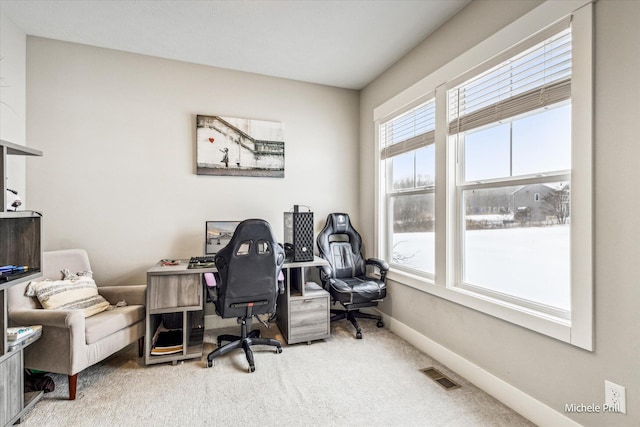 office with carpet flooring, visible vents, and baseboards