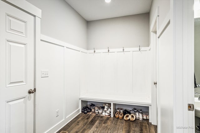 mudroom with dark wood-style floors