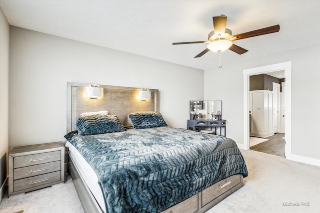 carpeted bedroom featuring ceiling fan and baseboards