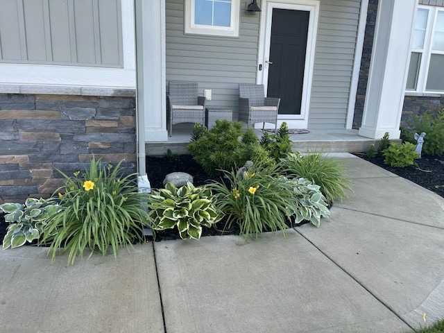 entrance to property with stone siding