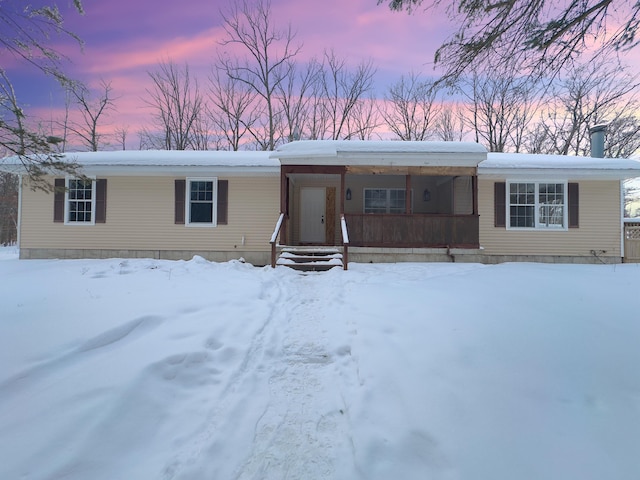 single story home featuring covered porch