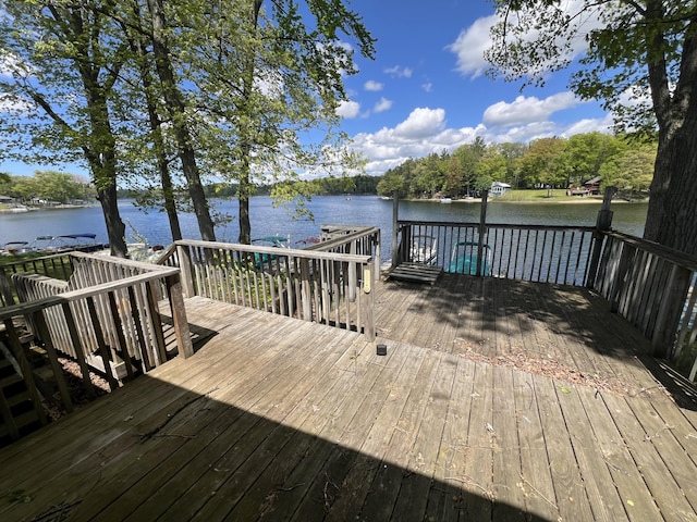5274 N Bahr Dr Unit 14, Irons, MI 49644 - wooden deck with a water view