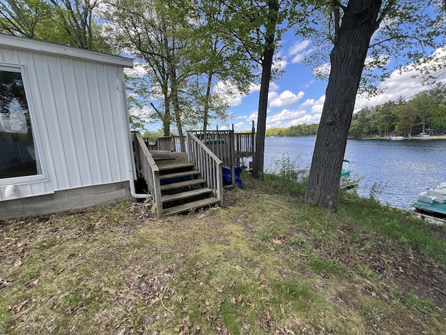 5274 N Bahr Dr Unit 14, Irons, MI 49644 - view of yard featuring a deck with water view and stairway