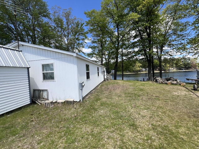 5274 N Bahr Dr Unit 14, Irons, MI 49644 - view of grassy yard featuring a water view