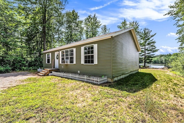 view of front of house with a front yard and driveway