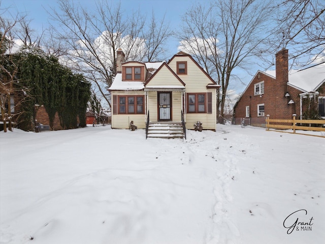 bungalow-style house featuring a chimney