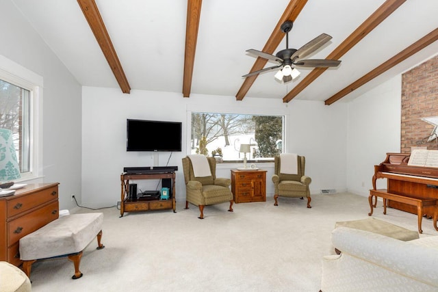 living area featuring light carpet, ceiling fan, lofted ceiling with beams, and visible vents