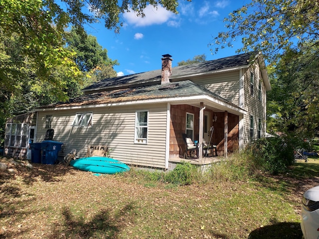 view of home's exterior featuring a yard and a chimney