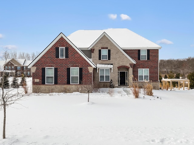 traditional-style home featuring brick siding