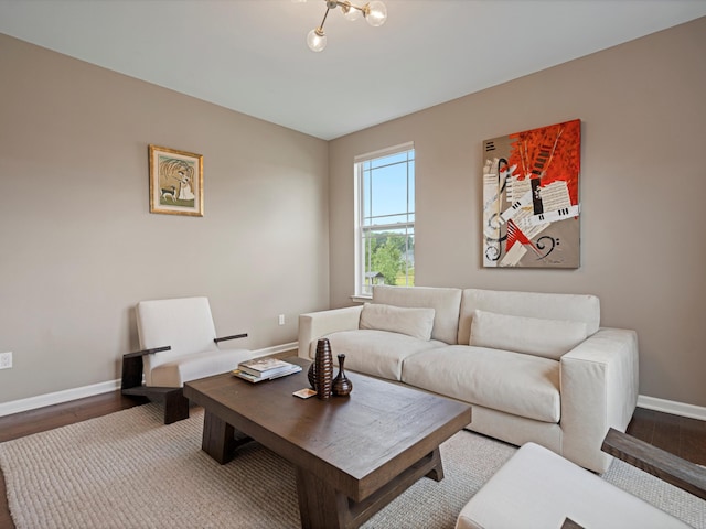 living room featuring baseboards and wood finished floors