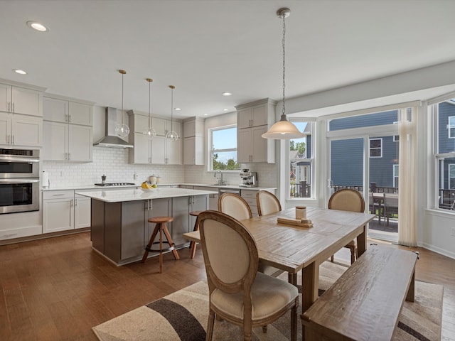 dining area featuring recessed lighting and dark wood finished floors