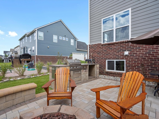 view of patio with an outdoor kitchen and area for grilling