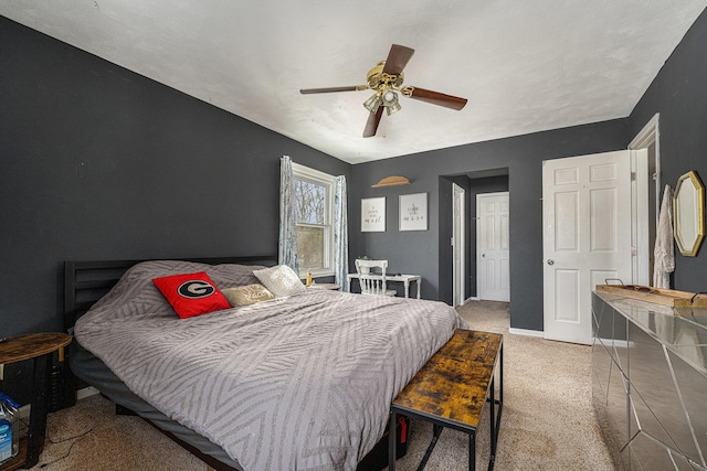 bedroom featuring ceiling fan and carpet floors