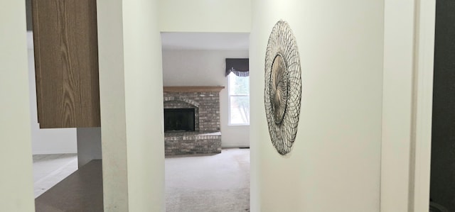 hallway featuring light colored carpet