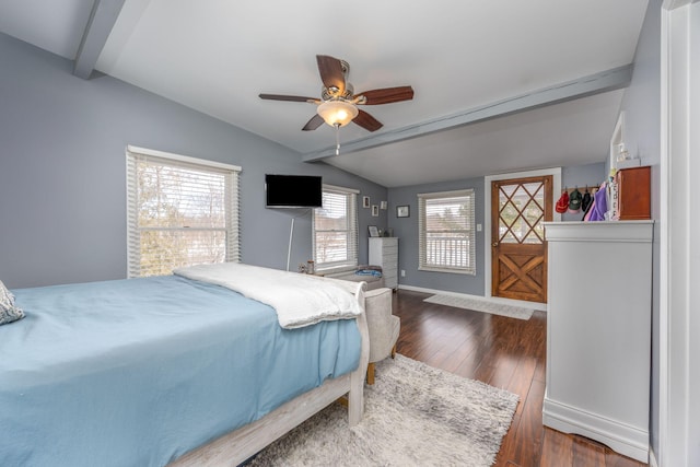 bedroom with dark wood finished floors, vaulted ceiling with beams, baseboards, and ceiling fan