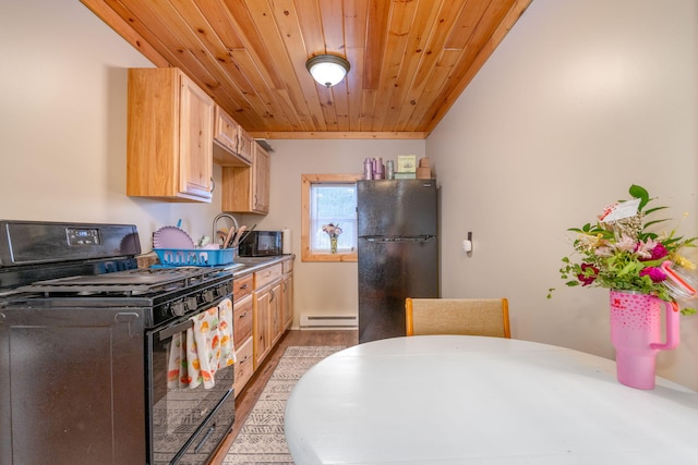 kitchen featuring black appliances, light brown cabinetry, baseboard heating, and wooden ceiling