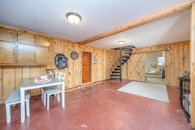 below grade area featuring wooden walls and stairs