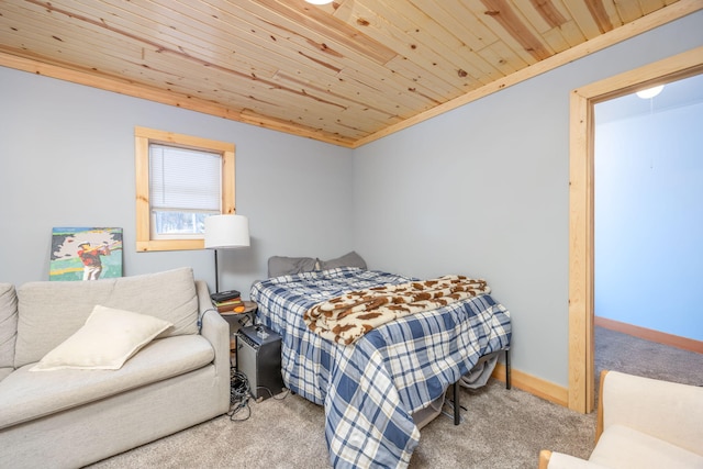 carpeted bedroom with wooden ceiling and baseboards