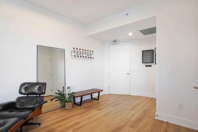 office space with recessed lighting, baseboards, and light wood finished floors