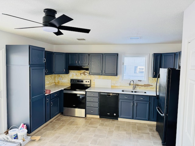 kitchen with blue cabinets, under cabinet range hood, light countertops, black appliances, and a sink