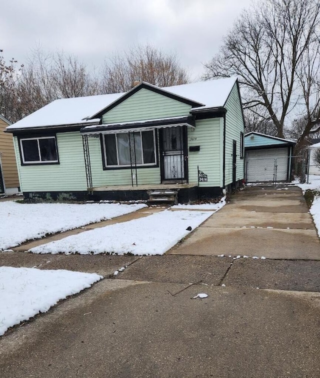 view of front of house featuring an outbuilding and a garage