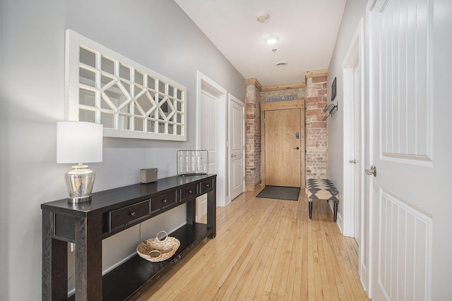 corridor with light wood-type flooring