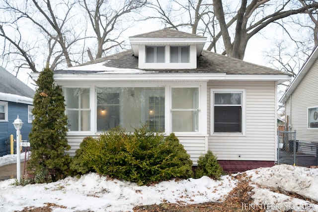 view of front of house with a shingled roof