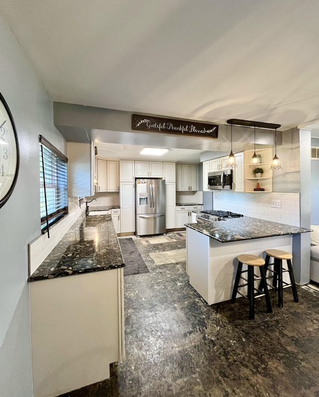 kitchen with a peninsula, appliances with stainless steel finishes, open shelves, and a breakfast bar area