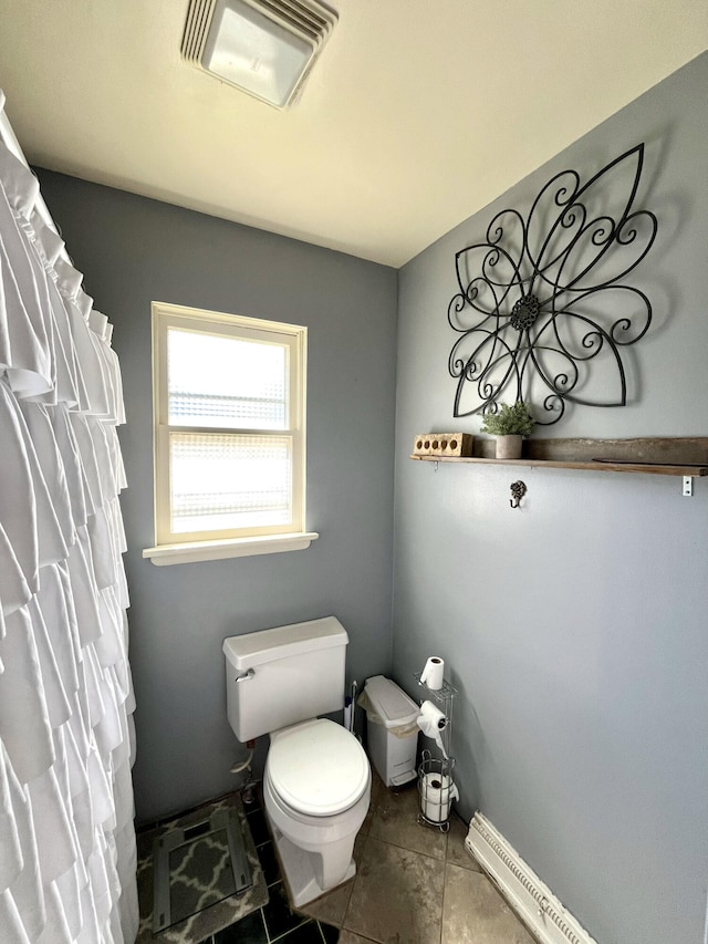 full bathroom featuring baseboards, visible vents, toilet, and tile patterned floors