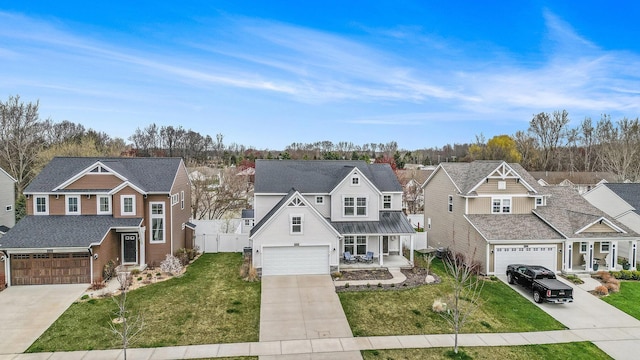 6745 Craftsman Square Dr NE, Rockford, MI 49341 - traditional home with covered porch, driveway, a residential view, fence, and a front lawn