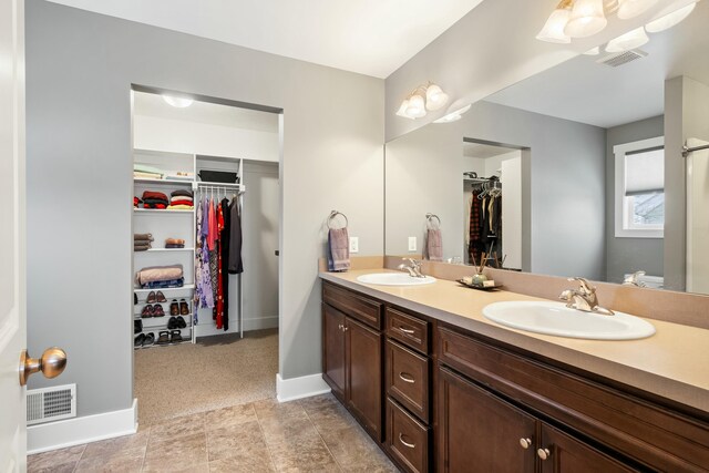 4588 Gordonshire NW, Grand Rapids, MI 49534 - full bath with double vanity, visible vents, and a sink