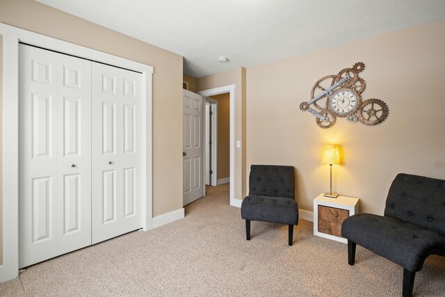 4588 Gordonshire NW, Grand Rapids, MI 49534 - living area with baseboards and light carpet