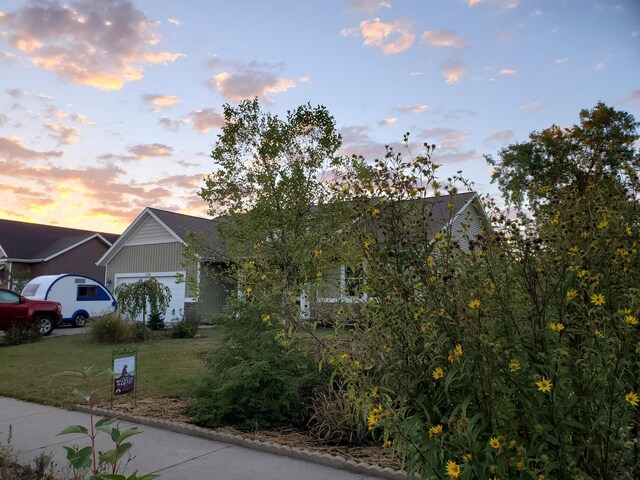 4588 Gordonshire NW, Grand Rapids, MI 49534 - view of front of home with a yard and a garage