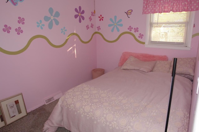 bedroom with carpet floors and visible vents