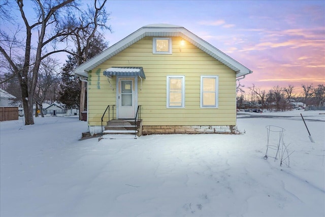 view of snow covered house